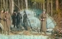Russian soldiers standing in front of an alien spacecraft in the forest